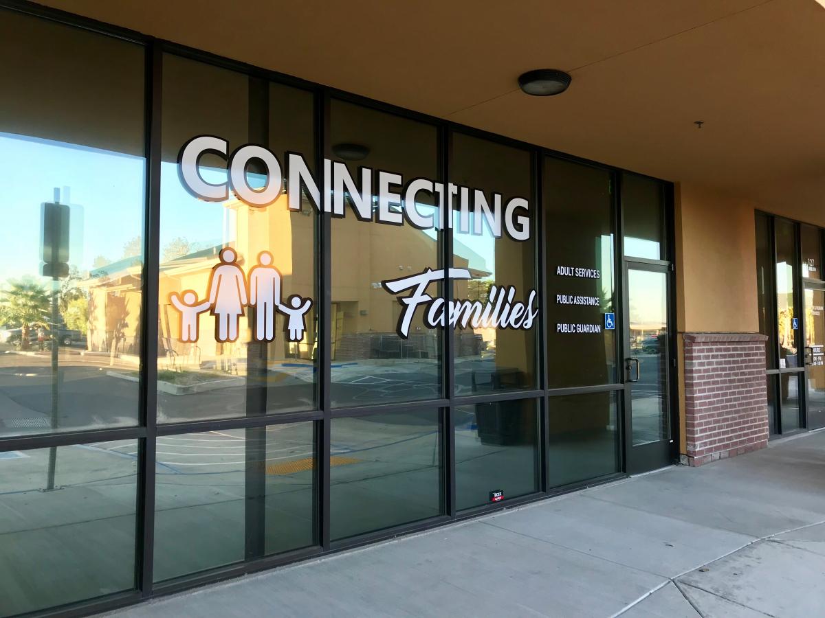 large Connecting Families logo on office window