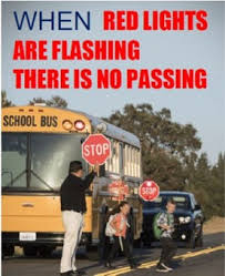 When red lights flash on a bus, there is no passing
